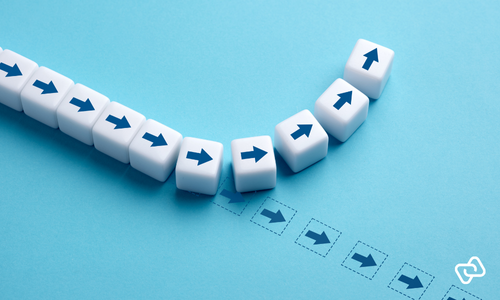 Illustration of blocks with arrows, with one block changing direction, symbolising improved pay transparency, clear salary structures, and data-driven HR decision-making.